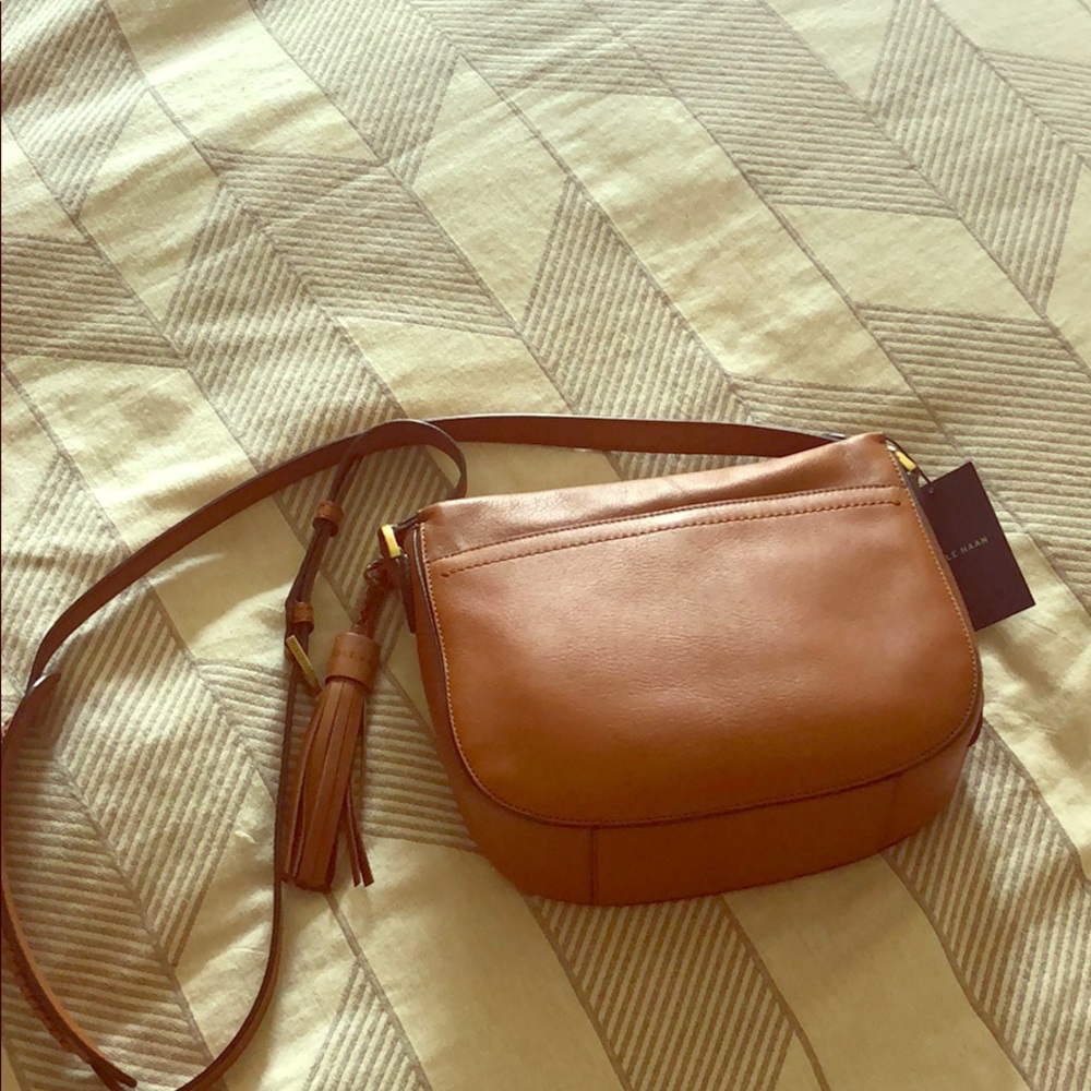 Brand new Cole Haan crossbody/saddle purse.